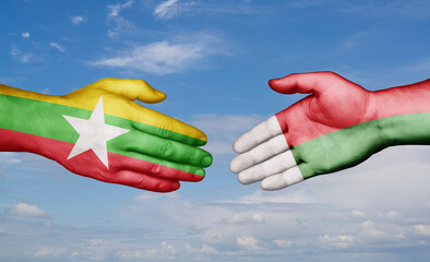 Madagascar and Myanmar country handshaking with flags, consensus concept international co-operation illustration