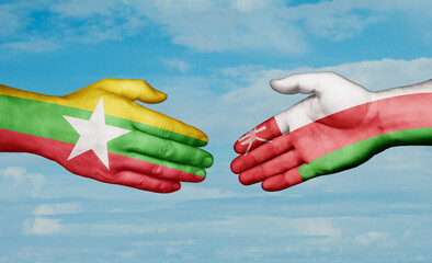 Oman and Myanmar country handshaking with flags, consensus concept international co-operation illustration