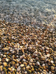 A beach with a large pile of rocks