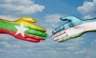 Republic of Uzbekistan and Myanmar country handshaking with flags, consensus concept international co-operation illustration