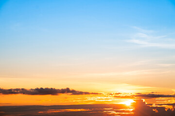 Obraz premium Beautiful , luxury soft gradient orange gold clouds and sunlight on the blue sky perfect for the background, take in everning,Twilight, Large size, high definition landscape photo