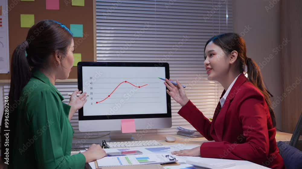 Poster two businesswomen discussing financial charts on a computer, analyzing data and collaborating on str