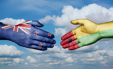 Guinea-Bissau and New Zealand country handshaking with flags, consensus concept international co-operation illustration