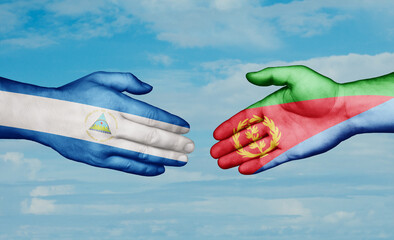 Eritrea and Nicaragua country handshaking with flags, consensus concept international co-operation illustration