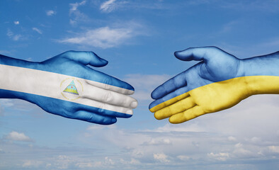 Ukraine and Nicaragua country handshaking with flags, consensus concept international co-operation illustration