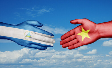 Vietnam and Nicaragua country handshaking with flags, consensus concept international co-operation illustration