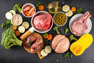 BARF food ingredients, healthy balanced diet for animal background. Biologically Appropriate Raw Food assortment for making barf trendy pet bowl