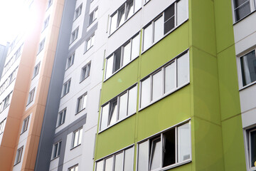 Modern high-rise buildings close-up windows of the house. Multi-storey residential building