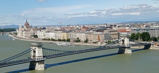 Fototapeta premium Budapest city. View at Chain bridge, river Danube and famous building of Parliament.