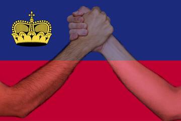 Two hands gathering front of Liechtenstein flag, union of society, togetherness and solidarity 