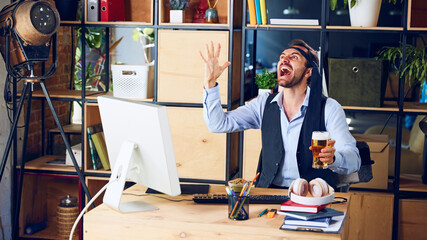 Man, professional, screams in frustration during workday while watching match in which his favorite...