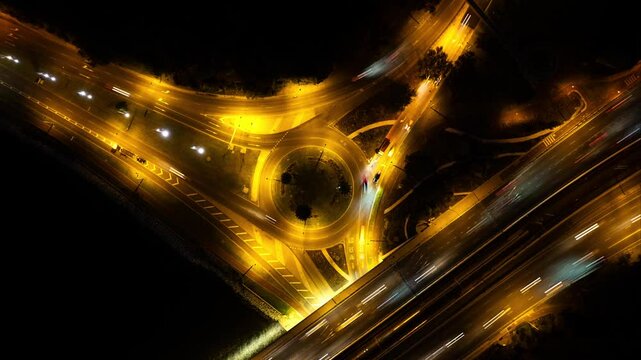 Beautiful top view Aerial 4K time-lapse of car traffic at roundabout lane and buildings above Mitchell Freeway Perth, Western Australia