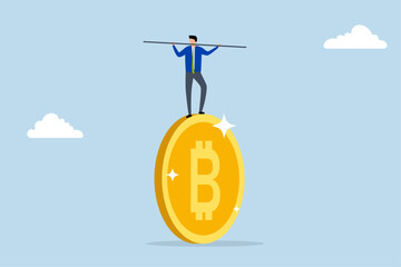 Bitcoin and crypto investment risk, Businessman investor performing like a tightrope walker on a massive bitcoin.
