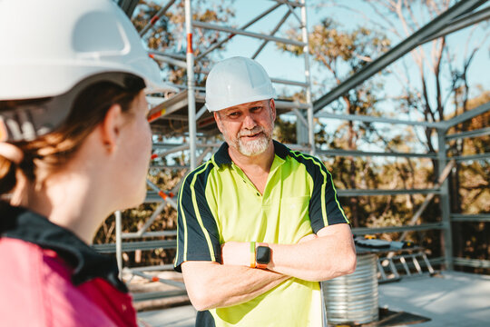Construction workers talking at the construction site
