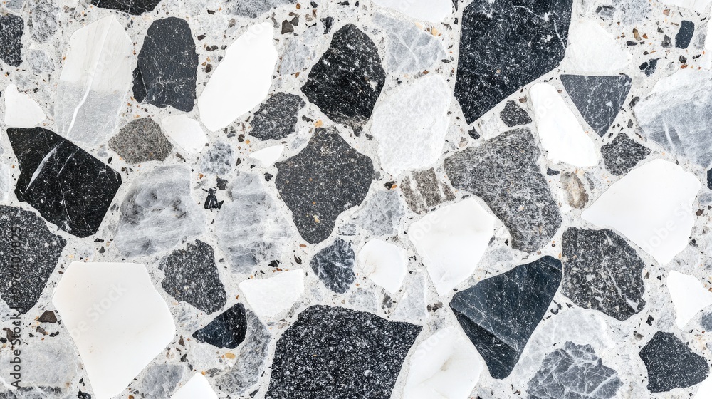 Poster a terrazzo surface with grey and white stone chips embedded, creating a sleek and elegant background