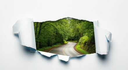 Torn white paper revealing serene road and lush greenery.