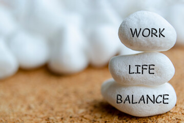 Work life balance text engraved on white stones. Life balance concept