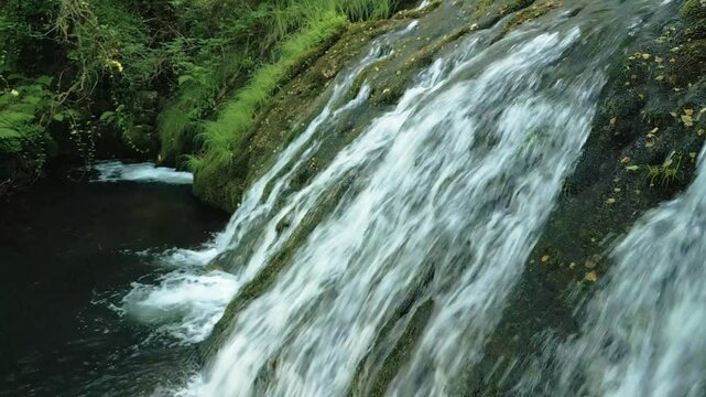 Parga Waterfall In Zas Water Route, Province Of Lugo In Spain. side view, pullback shot