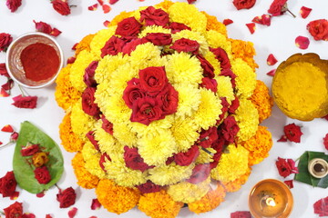 colorful flowers stacked up to create bathukamma, a specific hindu god worshiped in south india