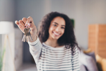 Photo of lovely cheerful girl hold key mortgage ownership dressed striped garment spend pastime...