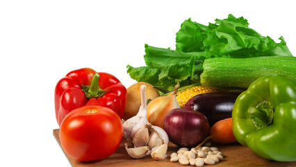 A vibrant assortment of fresh organic vegetables, including lettuce, tomato, pepper, garlic, and zucchini, displayed on a wooden cutting board, symbolizing healthy eating and natural produce.