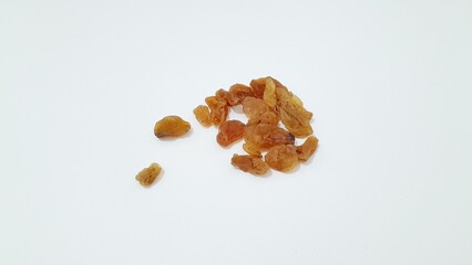 Yellow raisins on a white background 