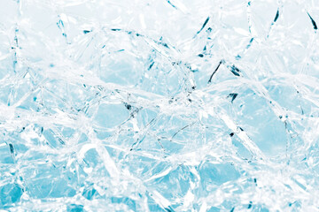 Obraz premium Abstract frozen ice texture with intricate crystal patterns on a light background