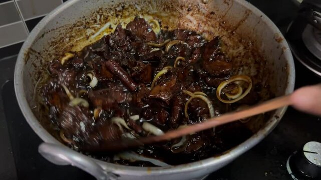 A sweet soy sauce beef or "daging masak kicap" cook by a mother at the house kitchen. It is a traditional Malaysia dish that very famous with it taste and sweetness.