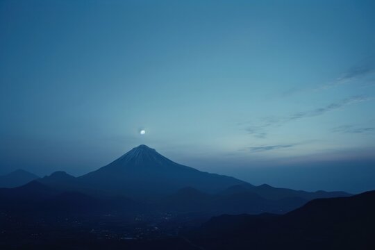 Single mountain moon sky astronomy.