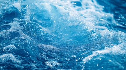 Fototapeta premium A close-up view of vibrant blue water with bubbling waves, capturing the essence of freshness and movement in nature.