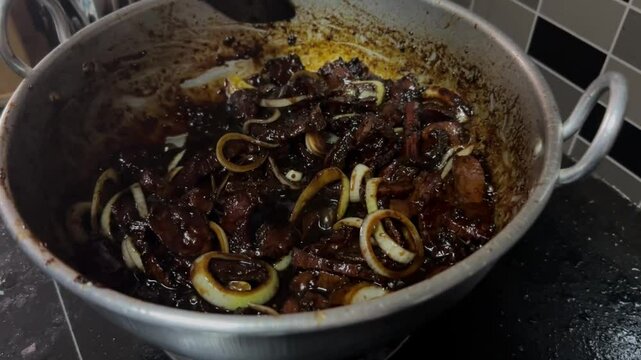 A sweet soy sauce beef or "daging masak kicap" cook by a mother at the house kitchen. It is a traditional Malaysia dish that very famous with it taste and sweetness.