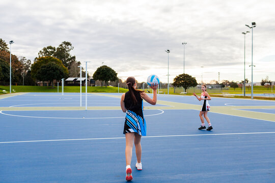 Two aboriginal sisters at the court training for netball team