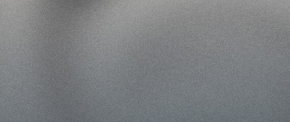 A soft, grainy texture in a black and grey gradient, with a blurred noise effect suited for dark design elements like banners or posters.