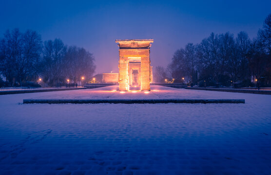 Snow-covered scene of the Templo de Debod in Madrid
