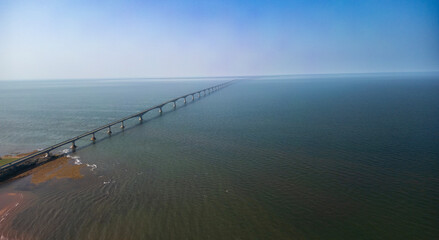 Obraz premium Confederation Bridge (French: Pont de la Confédération) is a box girder bridge carrying the Trans-Canada Highway across the Abegweit Passage of the Northumberland Strait, aerial view