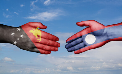 Laos and Papua New Guinea country handshaking with flags, consensus concept international co-operation illustration