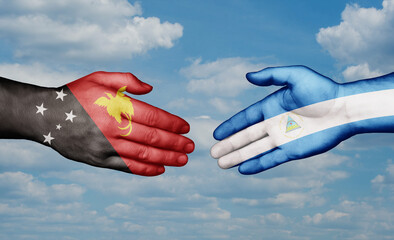 Nicaragua and Papua New Guinea country handshaking with flags, consensus concept international co-operation illustration