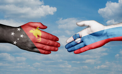 Slovenia and Papua New Guinea country handshaking with flags, consensus concept international co-operation illustration
