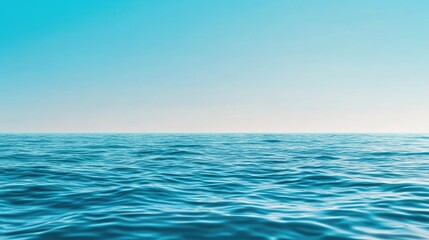Fototapeta premium A serene view of calm ocean waters under a clear blue sky, evoking tranquility and peace in nature.