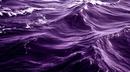 A stunning view of purple ocean waves, showcasing the beauty and dynamics of nature's water patterns under sunlight.