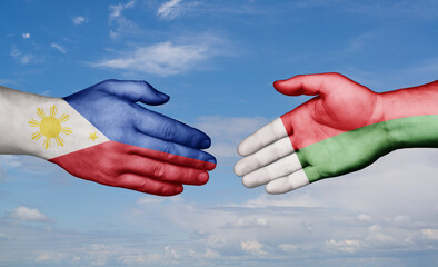 Madagascar and Philippines country handshaking with flags, consensus concept international co-operation illustration