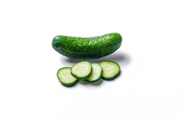 Three cucumbers are cut in half and placed on a white background. The cucumbers are fresh and green, and they are arranged in a way that makes them look like they are ready to be eaten