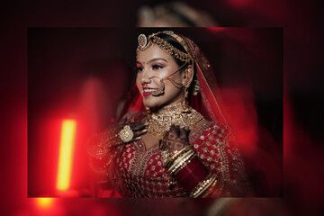 Beautiful Indian Bride in Traditional Red Wedding Dress and Gold Jewelry