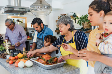 Latin family cooking together for Christmas dinner at home in Mexico Latin America, hispanic...