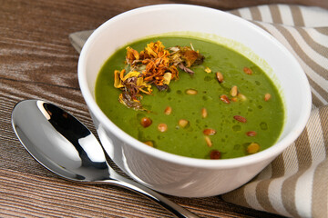 RECIPE FOR LEEK AND POTATO SOUP WITH GOLDEN PINE NUTS AND DRIED FLOWERS, High quality photo