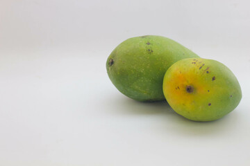 Green mango fruit on white background