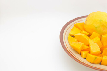 Peeled mango on a white background