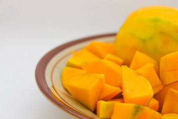 Peeled mango on a white background