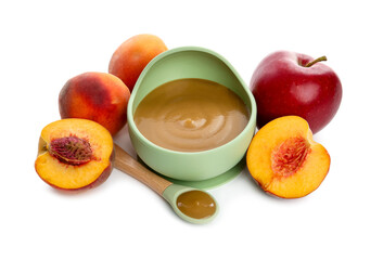 Delicious baby food in bowl with spoon and fresh ingredients isolated on white