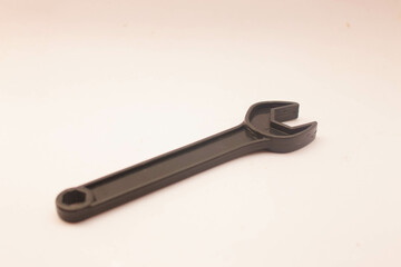 Black Toy Wrench 1
Toy craftsman tool in the shape of a wrench on a white background